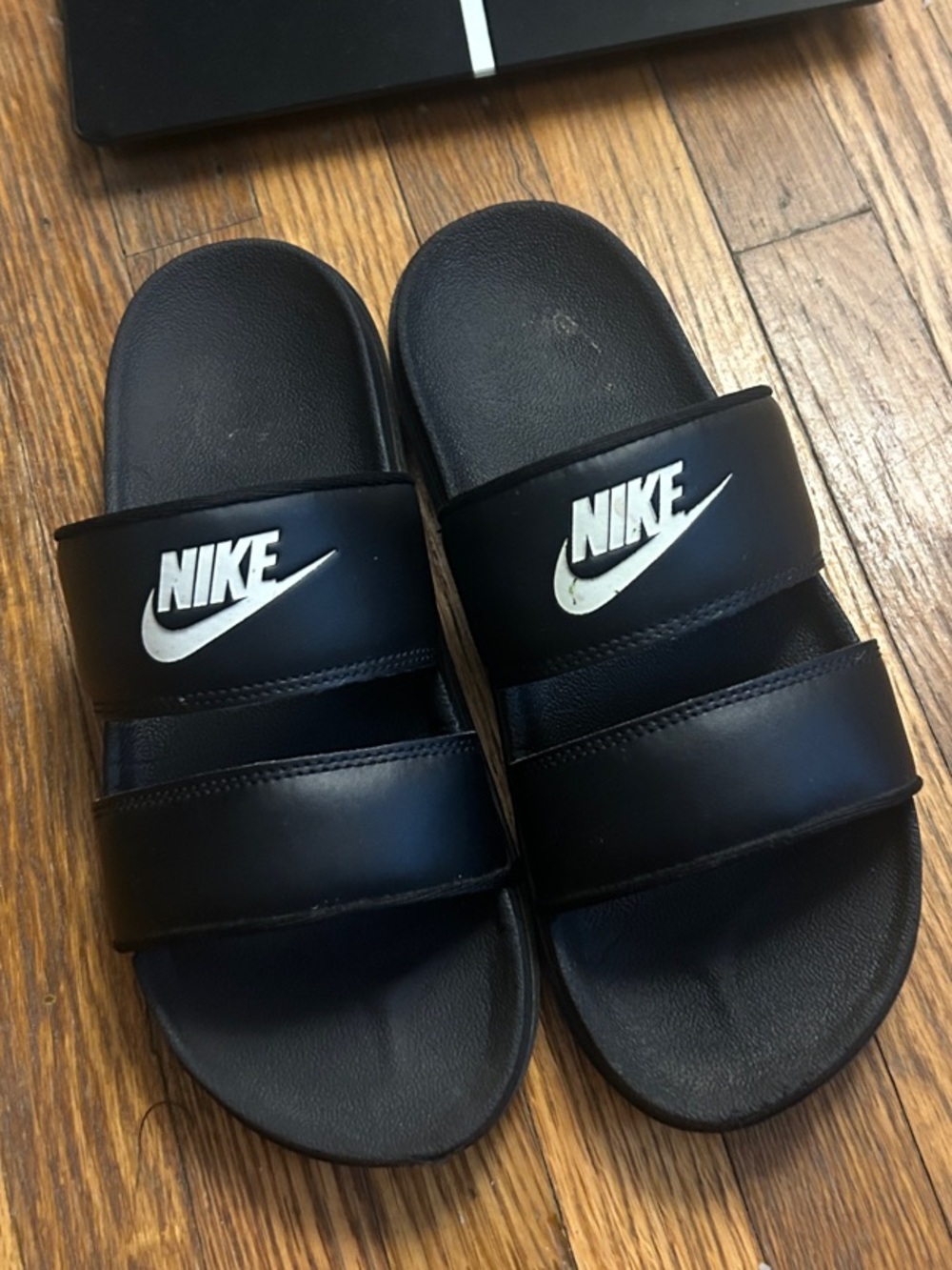 Nike Black Slide Sandals with White Swoosh Logos
